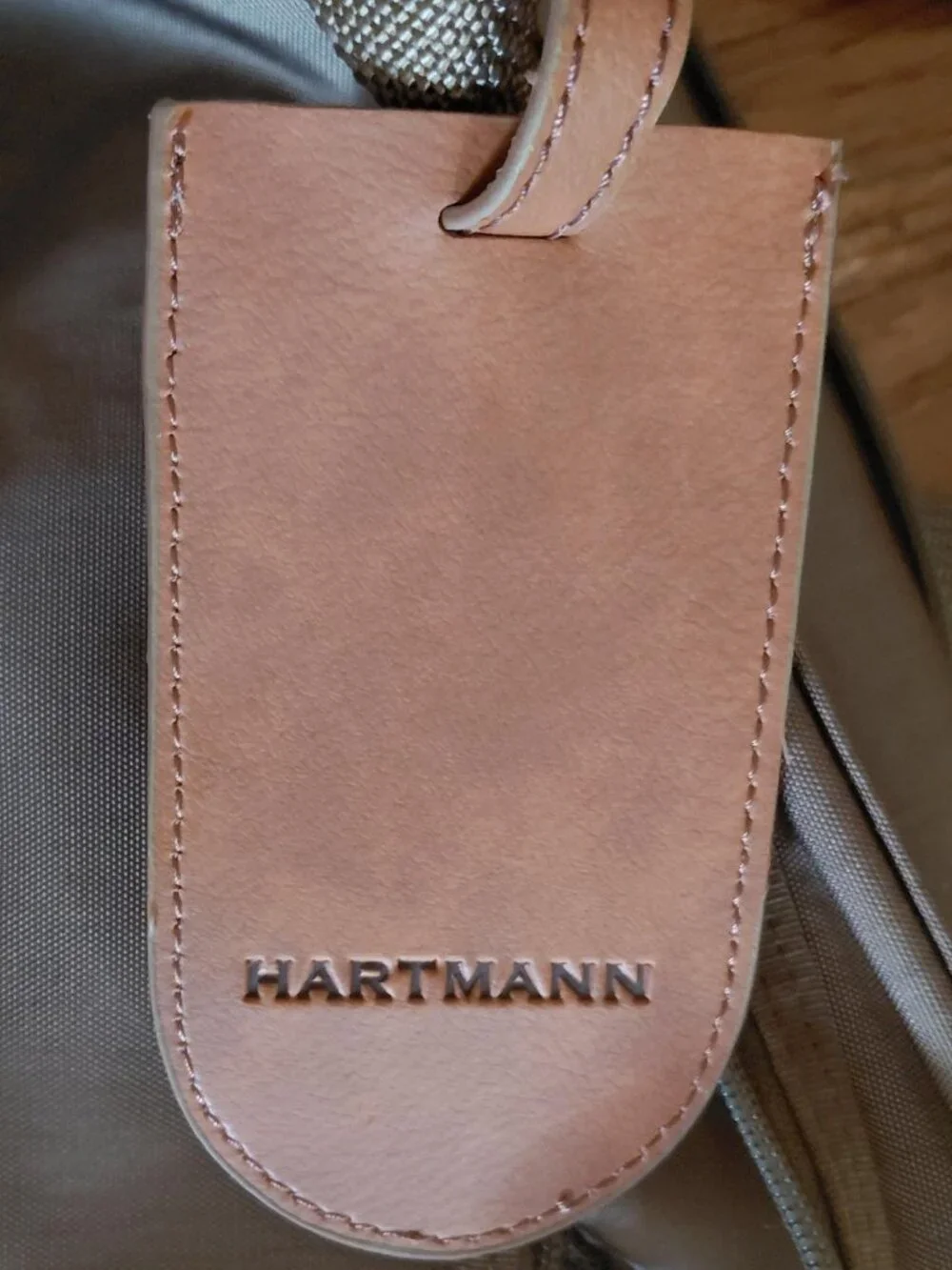 Features 2 deep front pockets with exterior/ interior zipper compartments galore